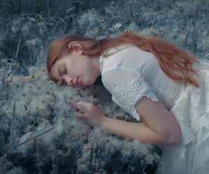 Close-up of a person's hands in a graceful pose.